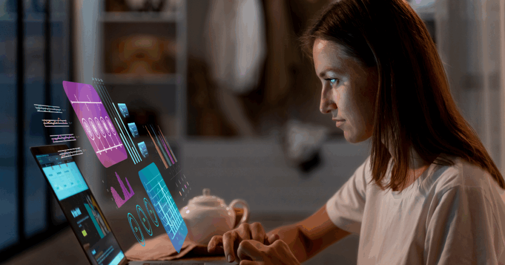 Moça jovem em frente a uma tela de computador com imagens gráficas saltando da tela